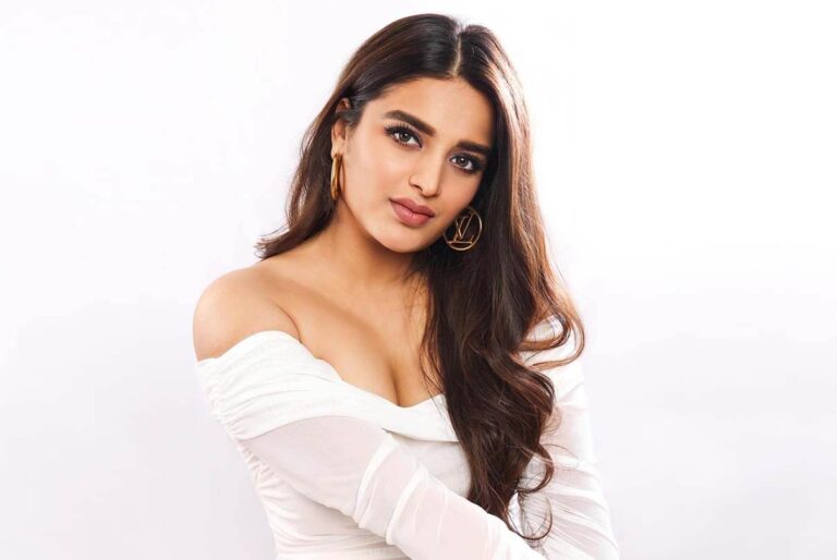 Nidhhi Agerwal Looks Breathtaking in White Off-Shoulder Bodycon Dress